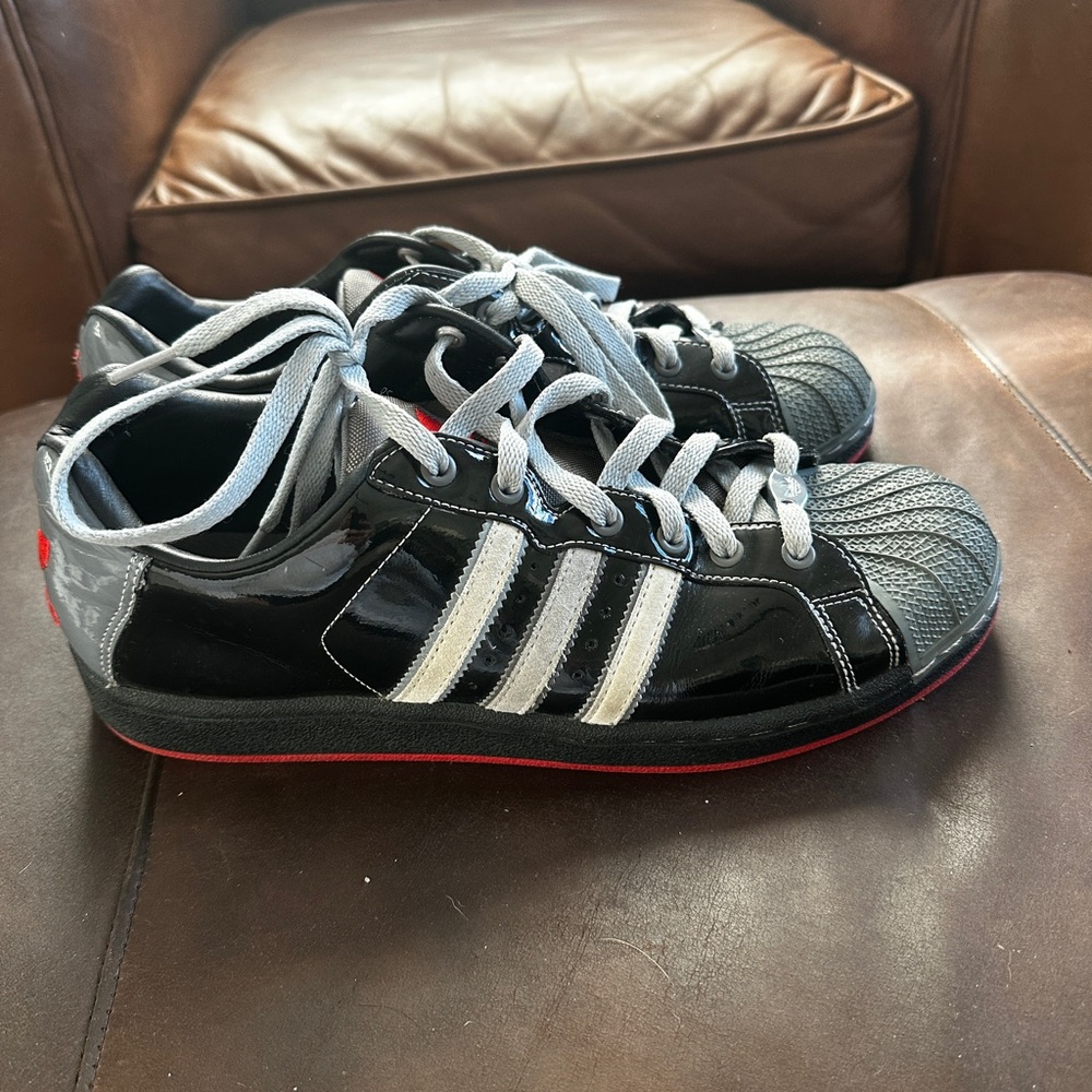 Adidas Black Superstar Sneakers with White Stripes and Red Sole Size 10